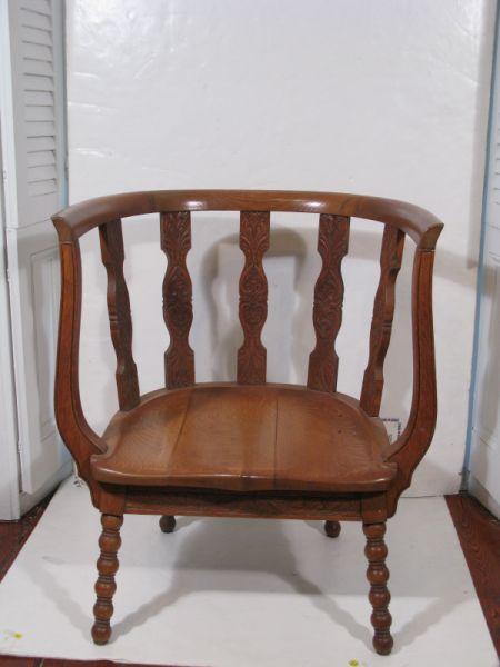 Appraisal: Oak Barrel Chair th c spindle back splat carved skirt