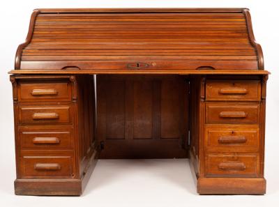 Appraisal: An American roll top desk fitted two banks of drawers