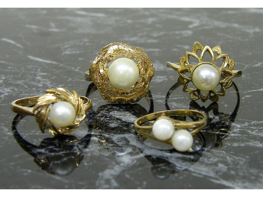 Appraisal: Four assorted yellow gold pearl rings gm