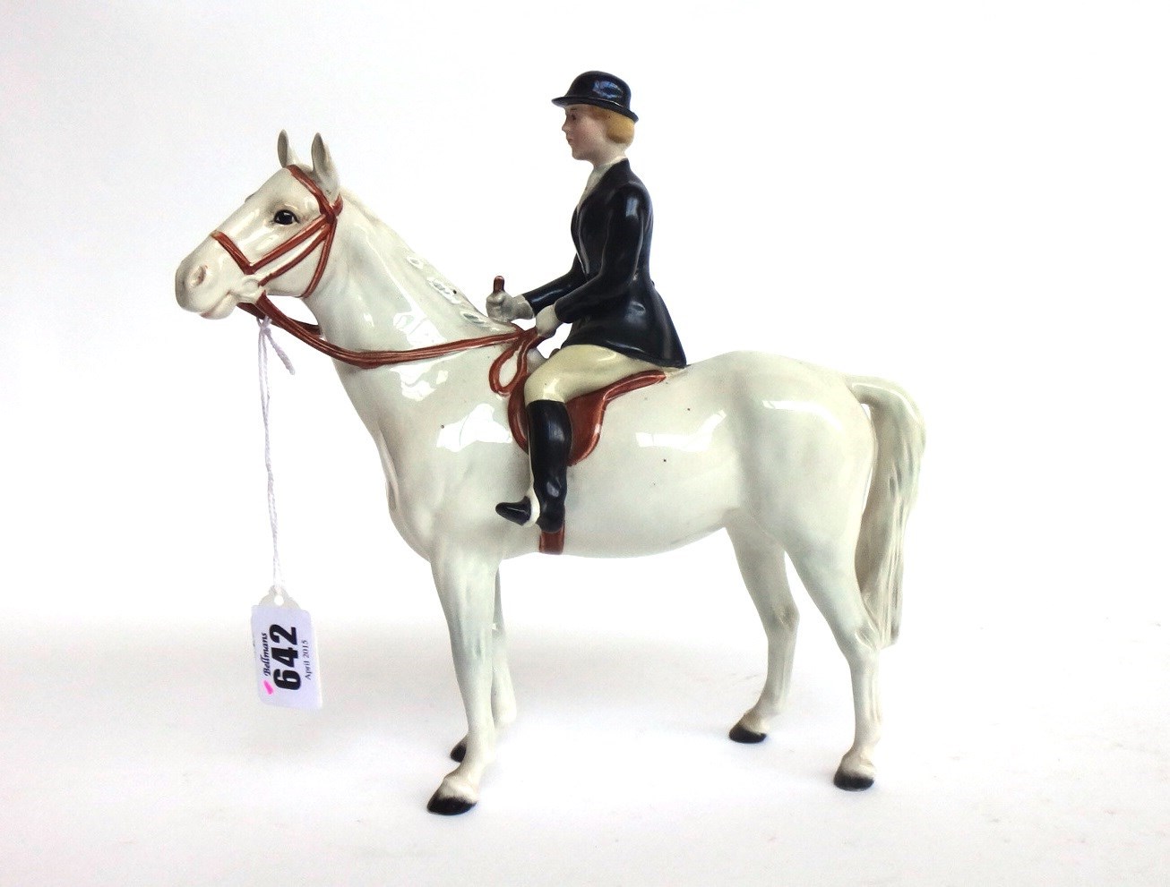 Appraisal: A Beswick huntswoman on a grey horse No black printed