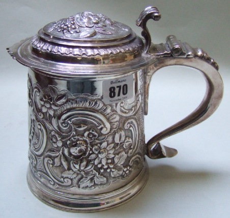 Appraisal: A silver hinge lidded large tankard the body and the