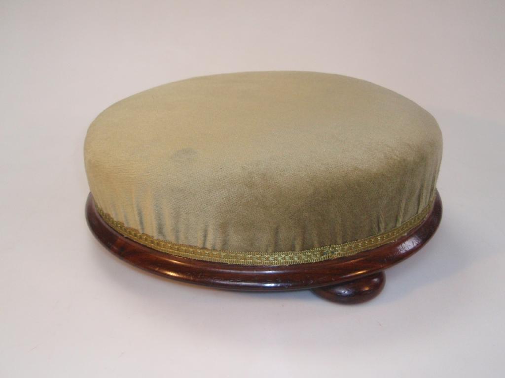 Appraisal: A Victorian rosewood circular footstool on bun feet