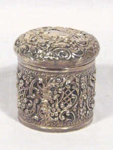 Appraisal: A silver and repousse round toilet box hallmarked Chester cm