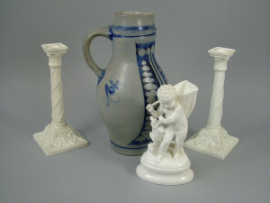 Appraisal: A pair of Royal Worcester Neo Classical style cream glazed