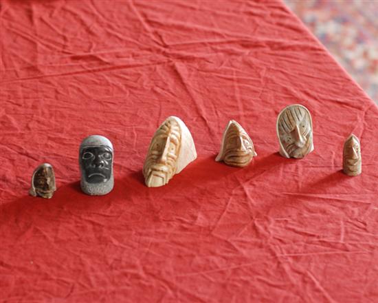 Appraisal: Six Carved Soapstone Faces two signed by Six Nations artist