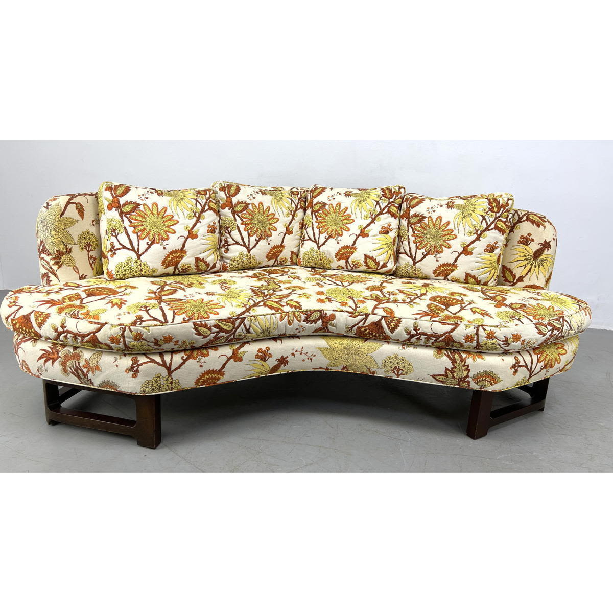 Appraisal: Dunbar attributed American Modern Walnut Sofa Floral Upholstery on angled