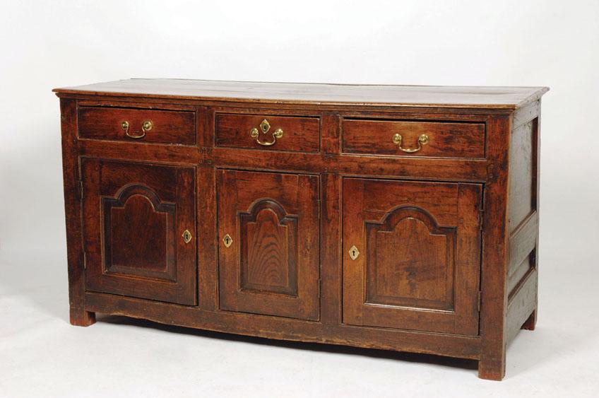 Appraisal: A GEORGE III OAK DRESSER BASE the rectangular top above