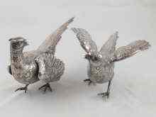 Appraisal: A pair of silver pheasants length cm London