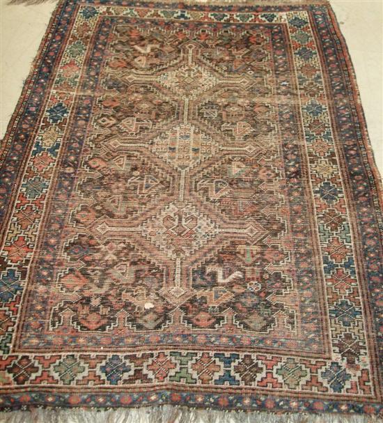 Appraisal: Two Persian rugs the first with a brown ground three