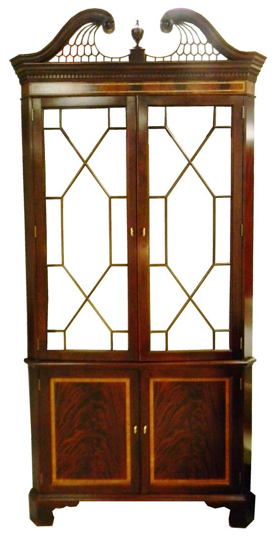 Appraisal: Chippendale style single piece corner cabinet figured mahogany with contrasting