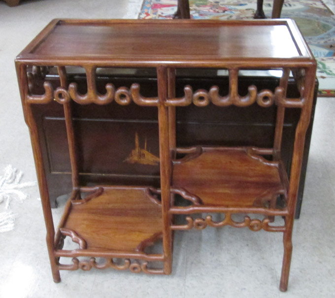 Appraisal: THREE-TIER ROSEWOOD DISPLAY TABLE Chinese th century having a rectangular