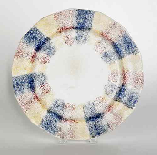 Appraisal: Red yellow and blue rainbow spatter plate th c dia