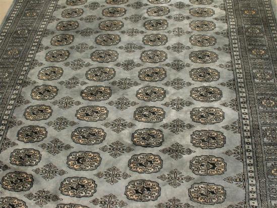 Appraisal: Blue grey ground Persian style carpet with bands of decoration