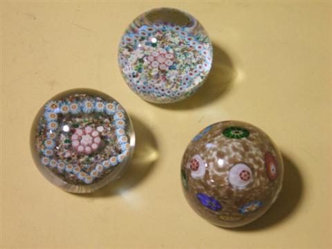 Appraisal: THREE COLOR GROUND PAPERWEIGHTS Including one Murano with scattered canes