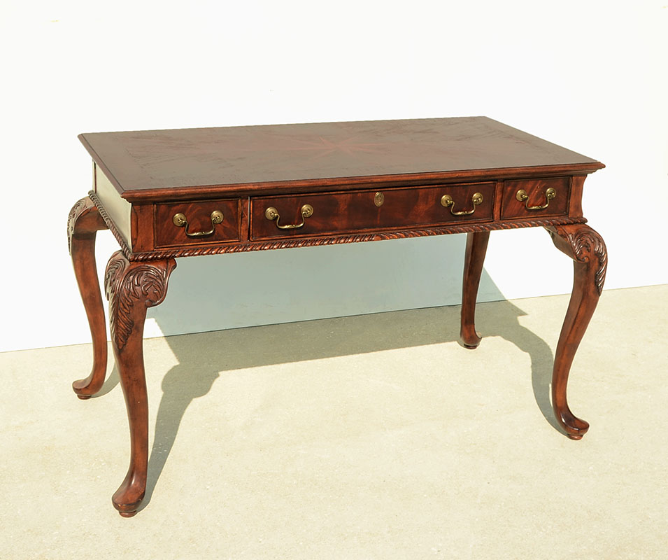 Appraisal: CARVED AND INLAID MAHOGANY DESK Top with inlaid center patera