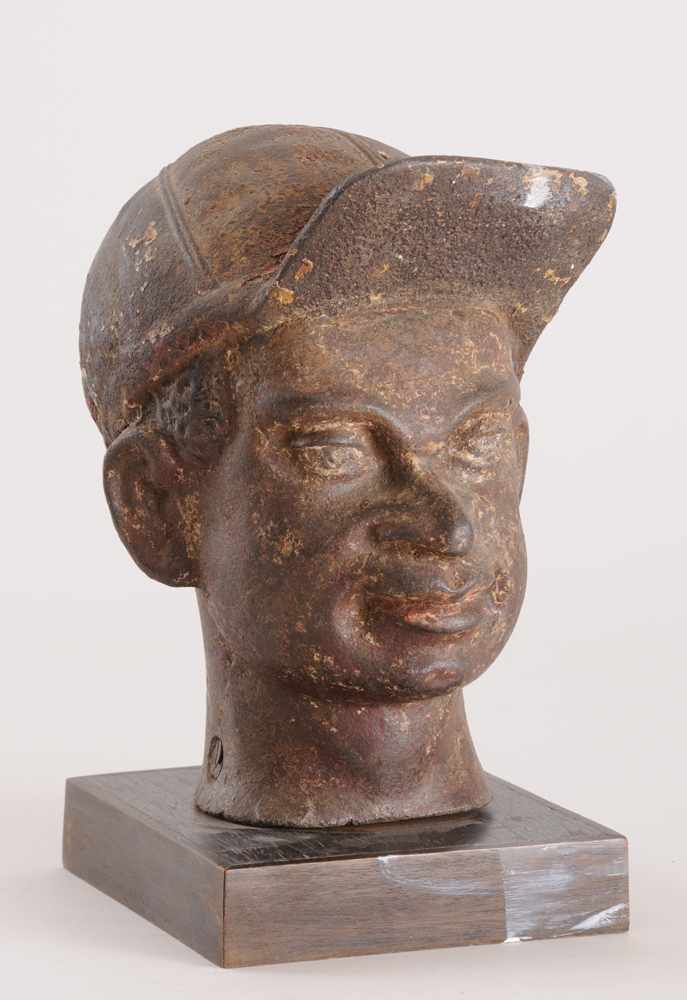 Appraisal: AMERICAN PAINTED CAST-IRON HEAD OF AN AFRICAN-AMERICAN JOCKEY Mounted on