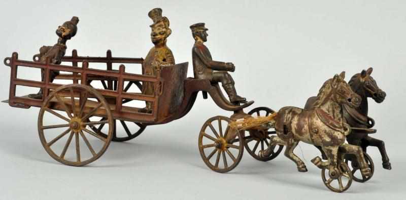 Appraisal: Cast Iron Horse-Drawn Happy Hooligan Wagon Toy American Includes two