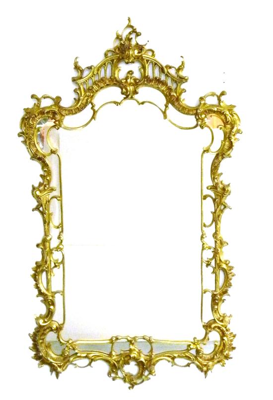 Appraisal: Rococo style oblong mirror in elaborate gilded brass frame pierced