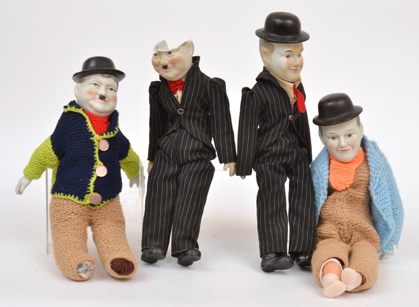 Appraisal: PAIRS OF LAUREL AND HARDY BISQUE FIRED DOLLS ONE PAIR