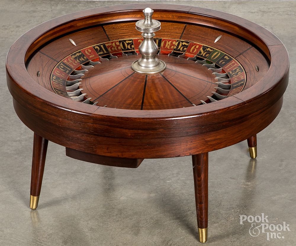 Appraisal: Roulette wheel coffee table by L Rube Roulette wheel coffee