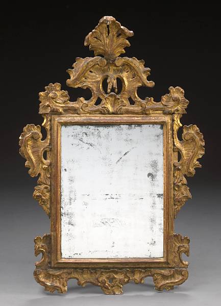 Appraisal: An Italian Rococo giltwood mirror late th century The rectangular