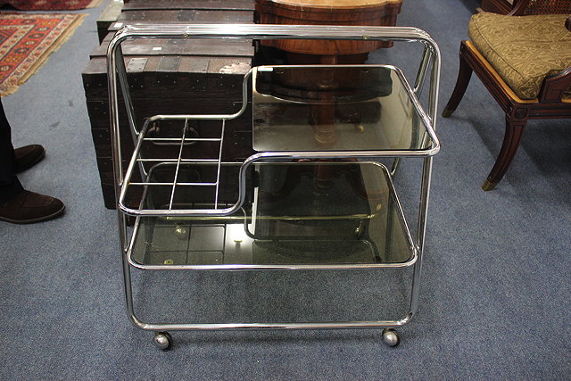 Appraisal: A VINTAGE CHROME AND GLASS TEA TROLLEY cm wide