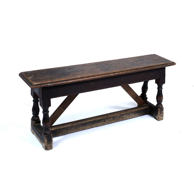 Appraisal: AN ANTIQUE OAK BENCH on turned legs united by an