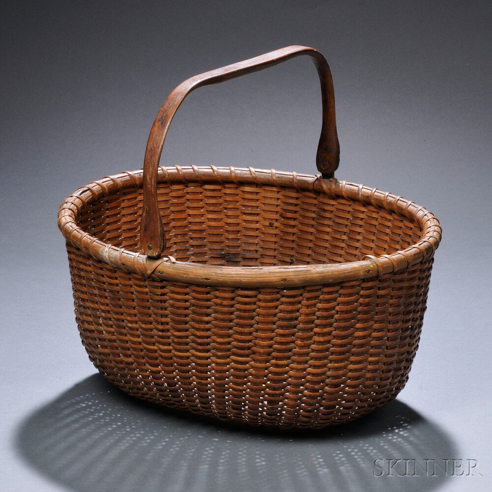 Appraisal: Oval Nantucket Basket early th century with carved hardwood swing