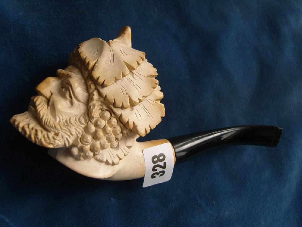 Appraisal: A carved Meerschaum pipe showing the head of a bearded