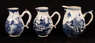 Appraisal: Three Chinese blue and white sparrow beak jugs Qing dynasty