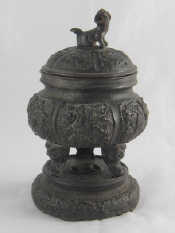 Appraisal: A Chinese bronze koro lid and cover on three mask