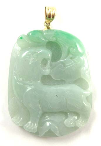 Appraisal: GREEN JADE AND FOURTEEN KARAT GOLD PENDANT The large green