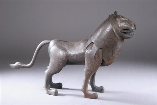 Appraisal: QAJAR -STYLE STEEL FIGURE OF LION Decorated in silver damascening