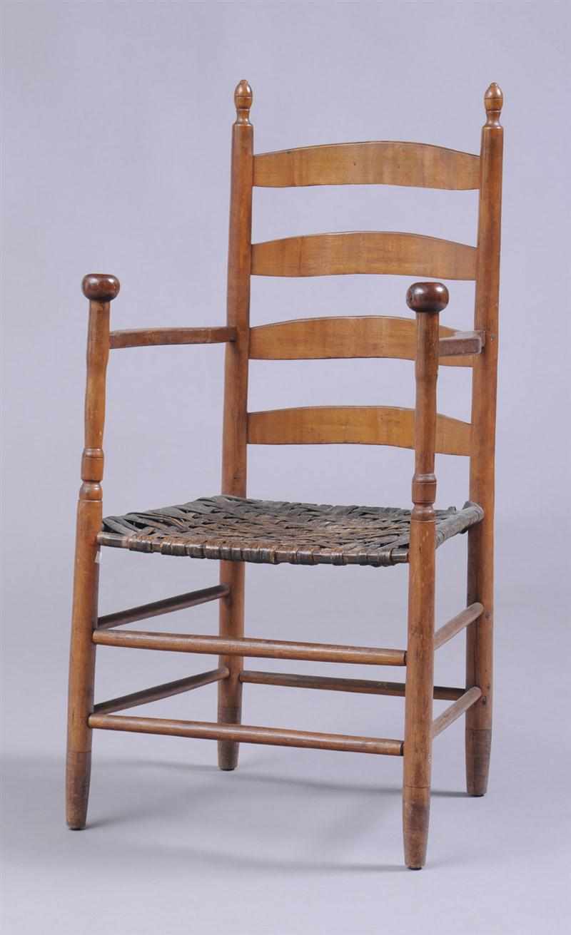 Appraisal: AMERICAN MAPLE LADDER-BACK ARMCHAIR The four arched splats on turned