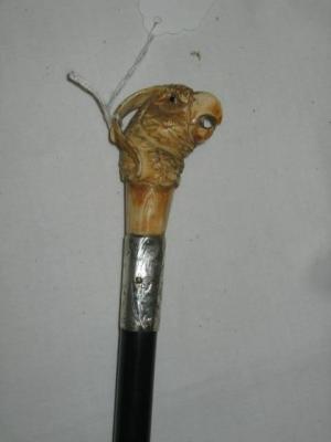 Appraisal: A WALKING STICK the ivory grip carved as a parrot