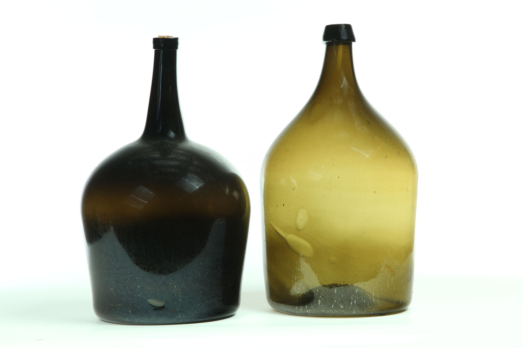 Appraisal: TWO DEMIJOHN BOTTLES American nd half- th century blown glass