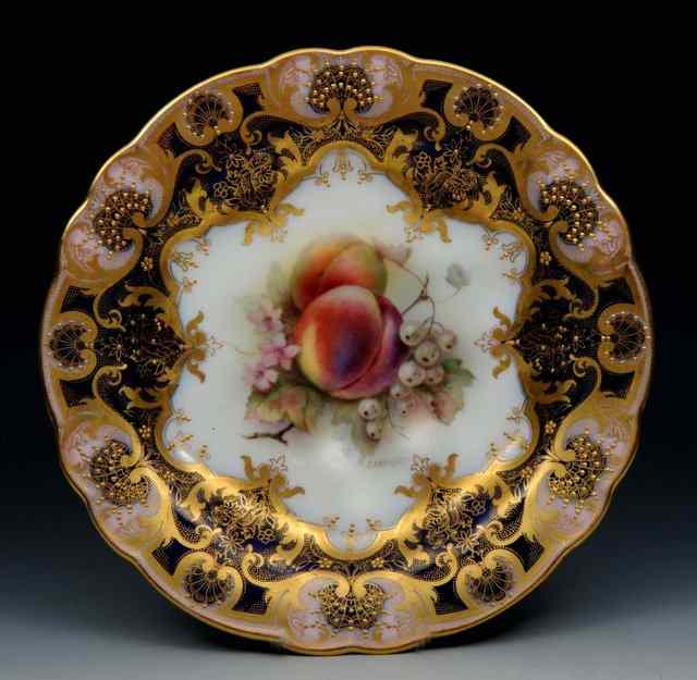 Appraisal: A ROYAL WORCESTER CABINET PLATE painted with fruit by Richard