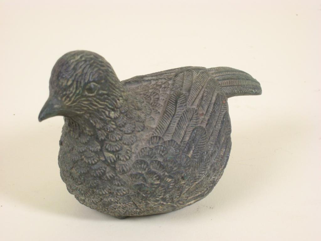 Appraisal: A small bronze seated figure of a bird with detailed