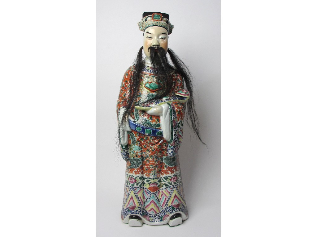 Appraisal: A Chinese famille rose figure of an official standing holding