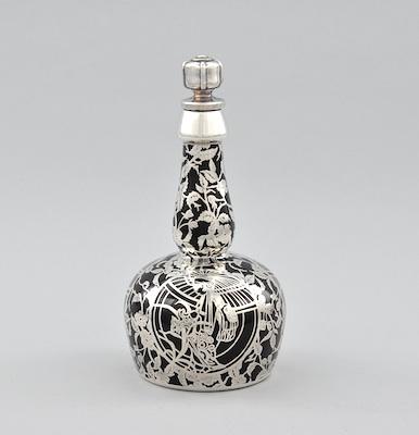 Appraisal: A Silver Overlay Bottle with Stopper A black glass bottle