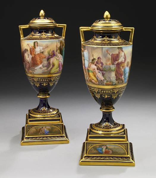 Appraisal: A pair of Vienna style porcelain two handled covered vases