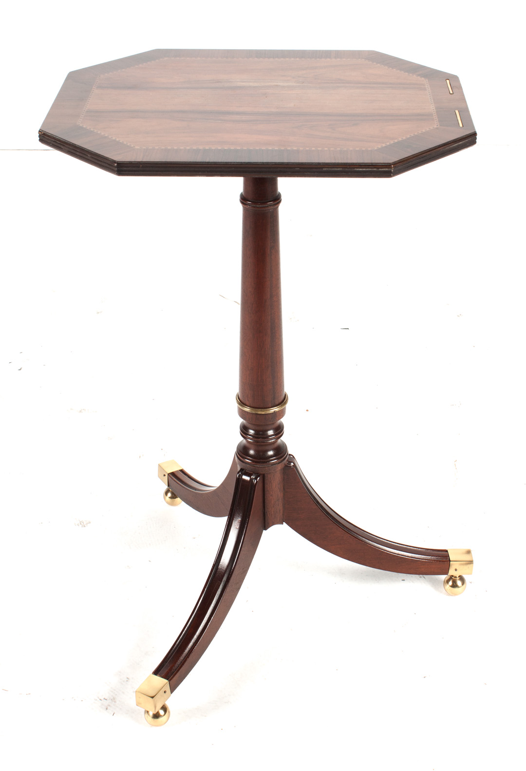 Appraisal: Baker Regency style rosewood candlestand octagonal shaped tilt top with