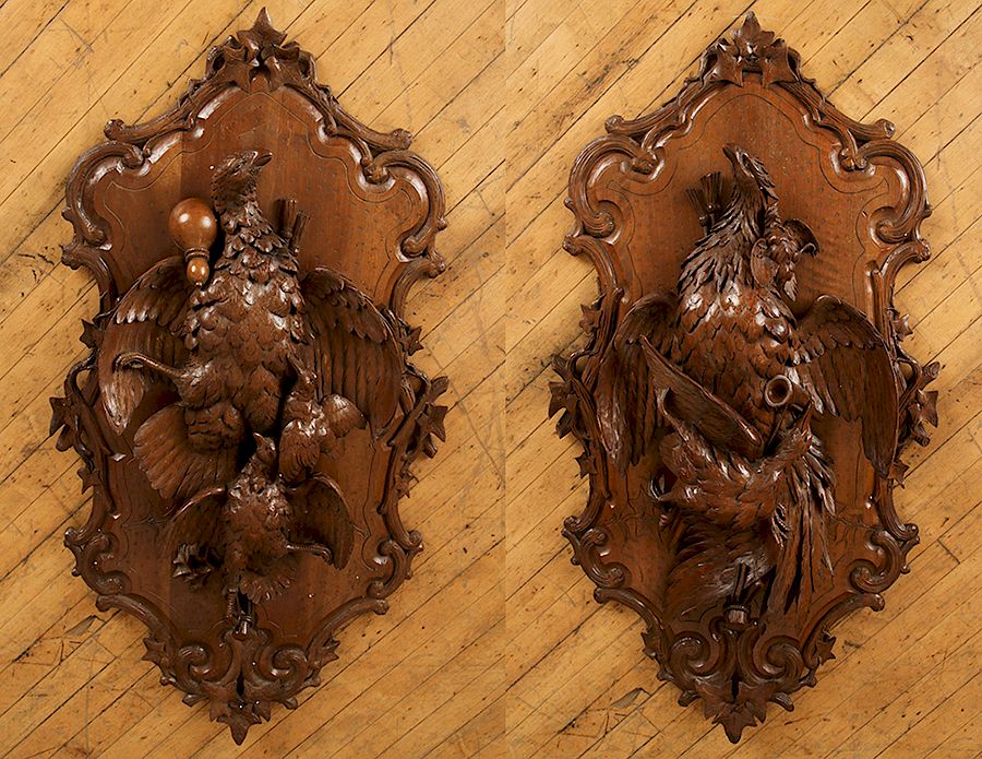 Appraisal: PAIR BLACK FOREST CARVED WALNUT PLAQUES A pair of late