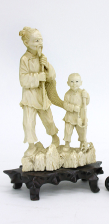 Appraisal: IVORY HAND CARVED FIGURAL GROUP Chinese fisherman carrying large fish