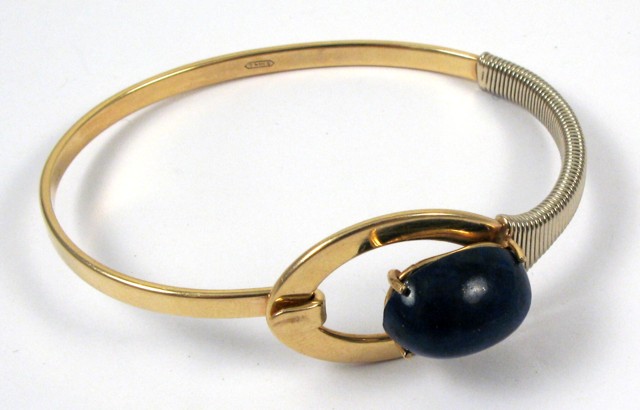 Appraisal: LAPIS LAZULI GOLD BANGLE The oval k yellow and white