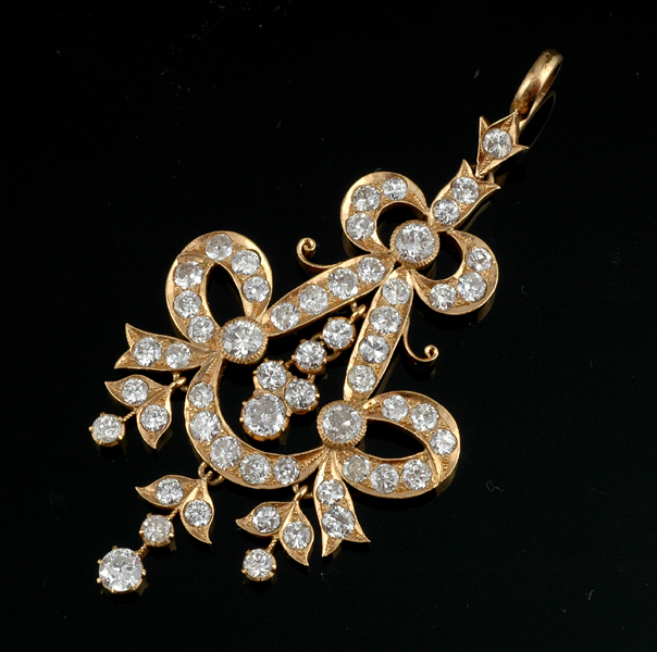 Appraisal: A DIAMOND CHANDELIER PENDANT The ct gold pierced pendant of