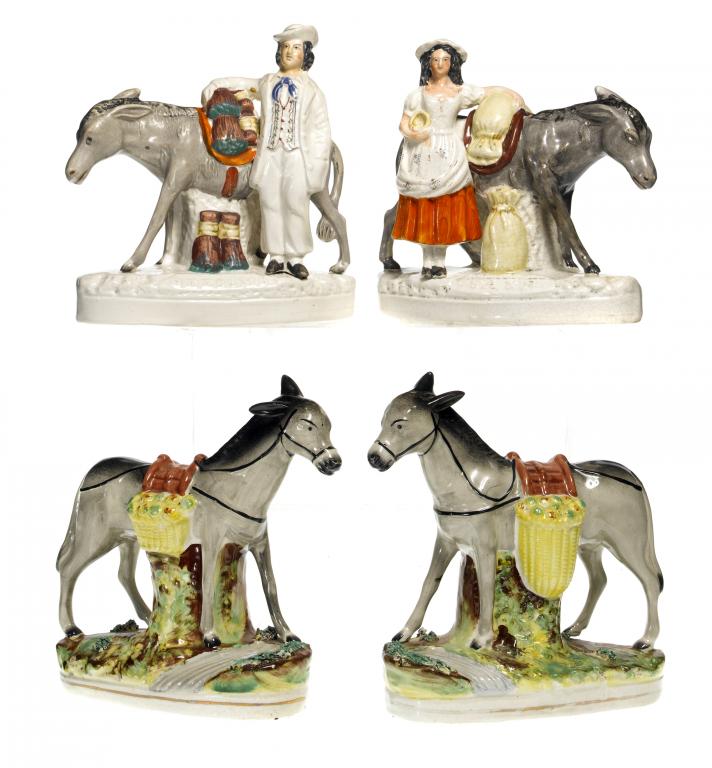 Appraisal: A PAIR OF STAFFORDSHIRE MODELS OF MULES LADEN WITH YELLOW