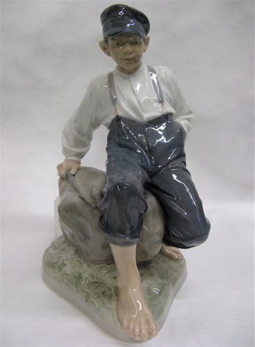 Appraisal: ROYAL COPENHAGEN FIGURE BOY ON STONE Barefoot boy seated on