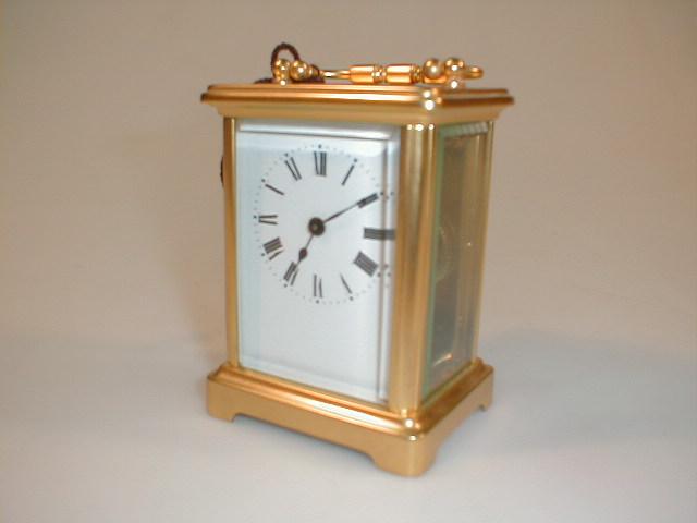 Appraisal: A gilt brass carriage timepiece high