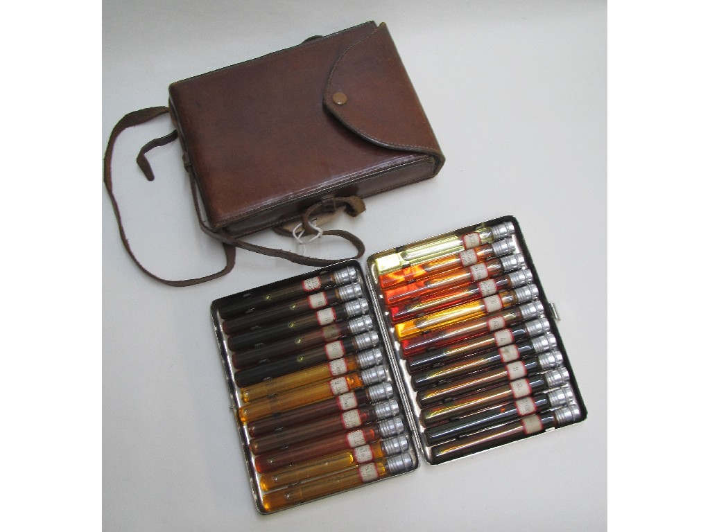 Appraisal: An oil sample case the plated hinged case containing thirty